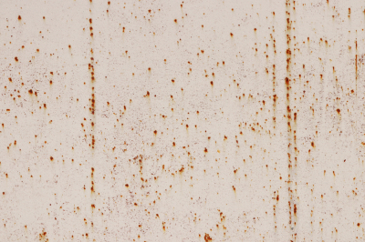 Rusty Grit on White Paint Wall Texture. Scratches and Cracks.