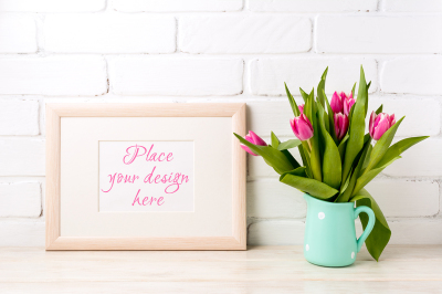 Wooden landscape frame mockup with bright pink tulips bouquet