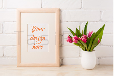 Wooden frame mockup with magenta pink tulips bouquet