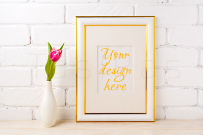 Gold decorated frame mockup with rich magenta pink tulip