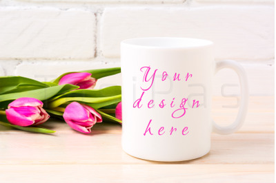 White coffee mug mockup with rich magenta pink tulips bouquet