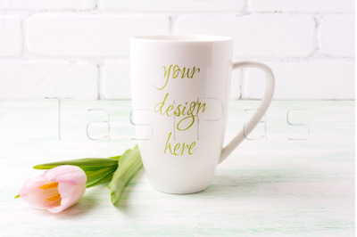 White coffee cappuccino mug mockup with tender pink tulip flower.