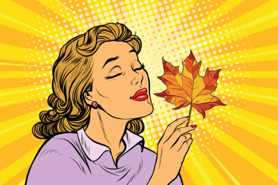 Girl and autumn, a woman with red maple leaf