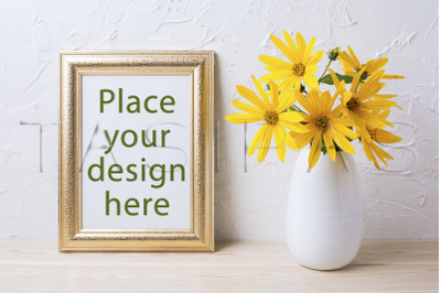 Golden frame mockup with yellow rosinweed flowers in vase.