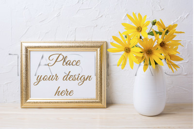 Landscape golden frame mockup with yellow rosinweed flowers.