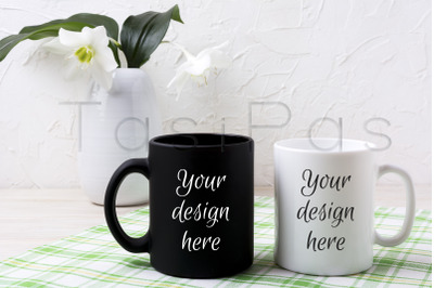 White and black mug mockup with lily in vase