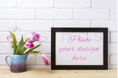 Black brown  landscape frame mockup with pink tulip in purple blue vas