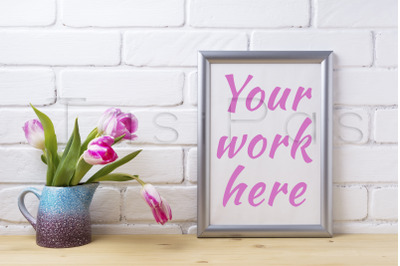 Silver frame mockup with pink tulip in purple blue vase