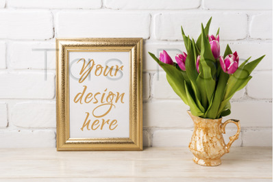 Golden frame mockup with magenta pink tulips in golden vase