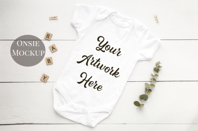 Babygrow, romper suit, onsie mockup with white wooden background