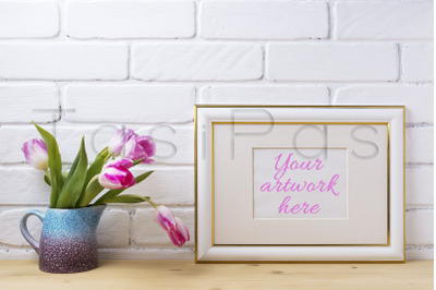 Gold decorated landscape frame mockup with magenta tulips