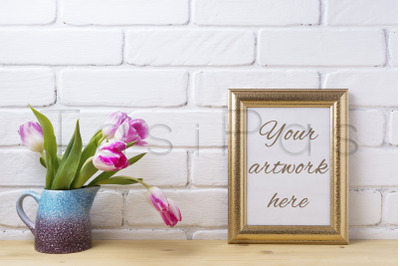 Gold decorated frame mockup with magenta pink tulips