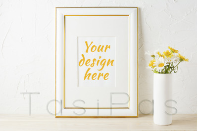Gold decorated frame mockup with wildflowers in pink vase