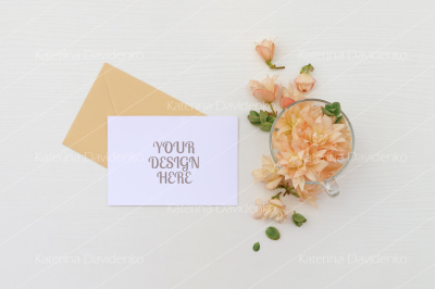 Postcard mockup whith flowers and envelope