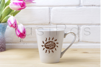 White latte mug mockup with magenta tulip.