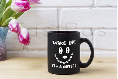 Black coffee mug mockup with magenta tulip.