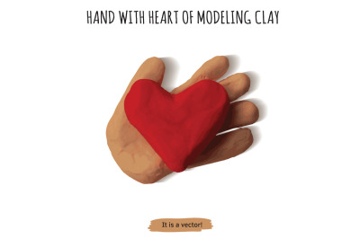 Isolated object hand with heart modeling clay