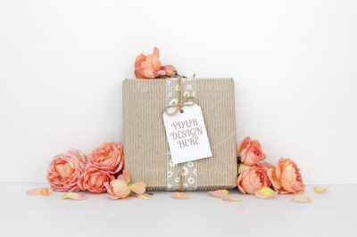 Gift box with a tag mockup, orange flowers