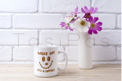 White coffee mug mockup with white and pink daisy