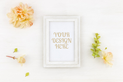 Flatlay wooden frame mockup with flowers, on white background