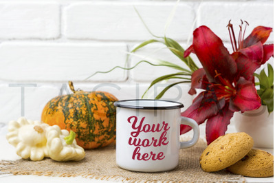 White campfire enamel mug mockup with cookie and red lily