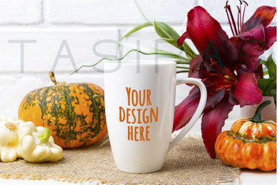 White coffee cappuccino mug mockup with pumpkin and red lily.