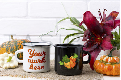 White and black campfire mug mockup with pumpkin and red lily.