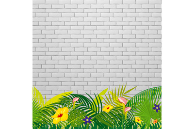 White brick wall background with tropical leaves and flowers