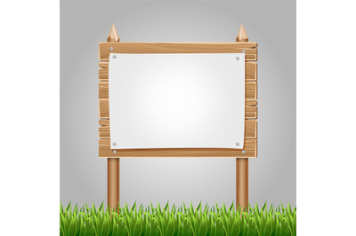 Wooden information blank with green grass