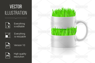 White mug with insertion of grass