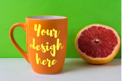 Orange coffee cappuccino mug mockup with grapefruit