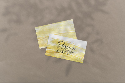 Business card Mockup. Natural overlay lighting shadows the leaves