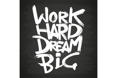 Work hard dream big phrase on blackboard