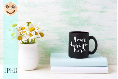 Black coffee mug mockup with white field chamomile bouquet in handmade