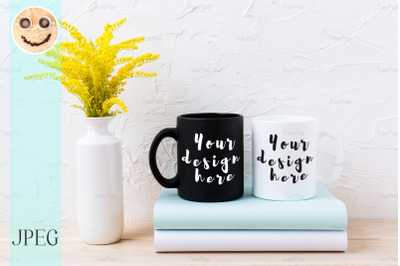 White and black mug mockup with ornamental yellow flowering grass