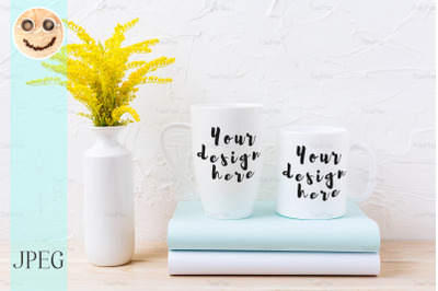 Two white coffee and cappuccino mug mockup with ornamental grass