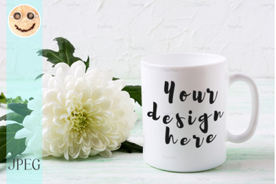 White coffee mug mockup with chrysanthemum