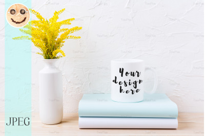 White coffee mug mockup with ornamental yellow flowering grass