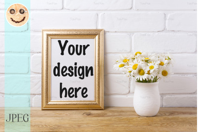 Golden&nbsp; frame mockup with chamomile bouquet in rustic vase.