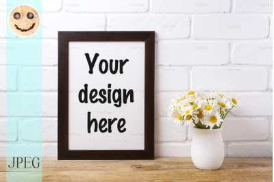 Black brown  frame mockup with chamomile bouquet in rustic vase