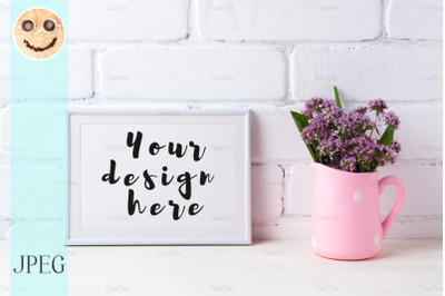 White landscape frame mockup with purple flowers in polka dot pink pit