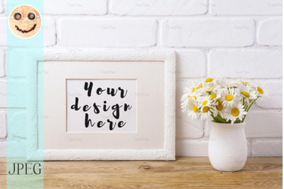 White landscape frame mockup with chamomile bouquet in rustic vase