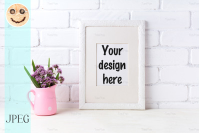 White frame mockup with purple flowers in pink rustic pitcher