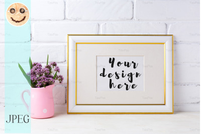 Gold decorated landscape frame mockup with purple flowers in pink rust