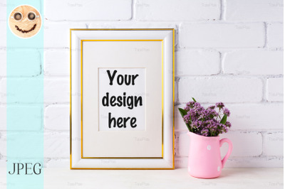 Gold decorated frame mockup with purple flowers in pink rustic pitcher