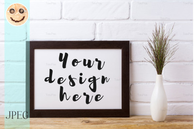 Black brown  landscape frame mockup with dark grass in elegant vase