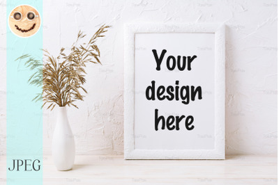 White frame mockup with decorative dried grass