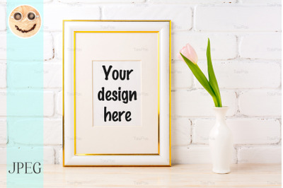 Gold decorated frame mockup with pale pink tulip in vase