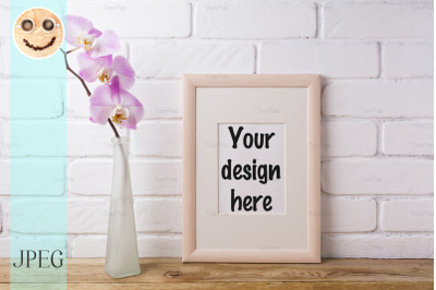 Wooden frame mockup with tender pink orchid