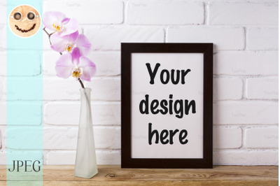 Black brown poster frame mockup with tender pink orchid